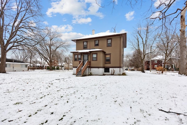 view of snow covered property