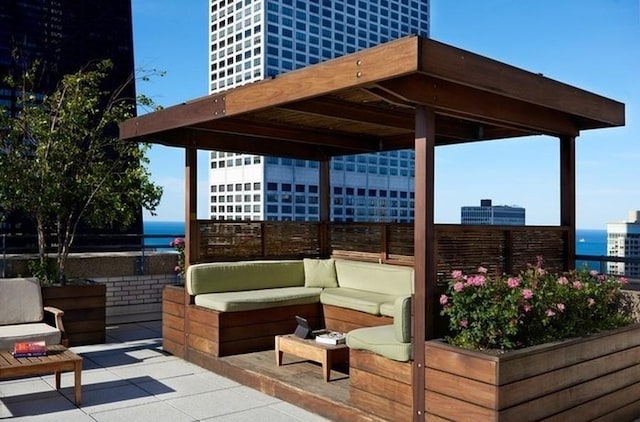 view of patio with a water view and an outdoor hangout area