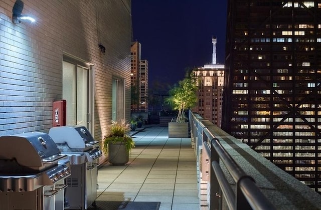 balcony at twilight with grilling area