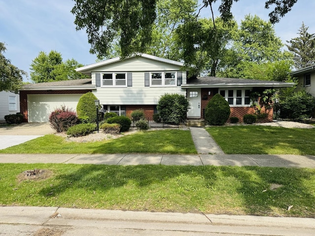 18947 Ridgewood Ave, Lansing, IL 60438 - tri-level home featuring brick siding, an attached garage, driveway, and a front lawn