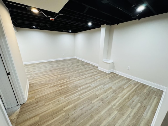 basement featuring light wood-type flooring