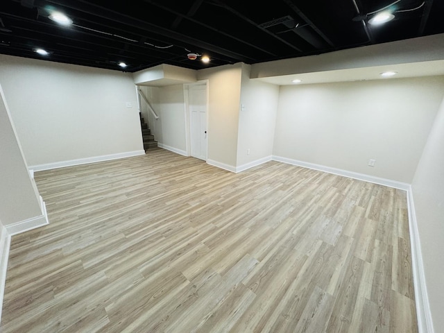 basement featuring light wood-type flooring