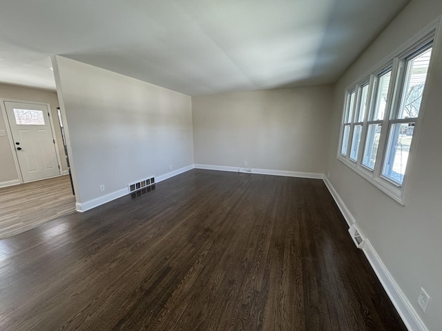 interior space with dark hardwood / wood-style floors