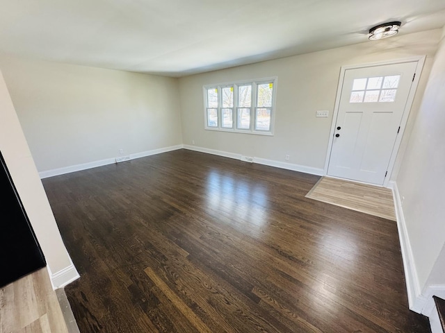 entrance foyer with dark hardwood / wood-style floors