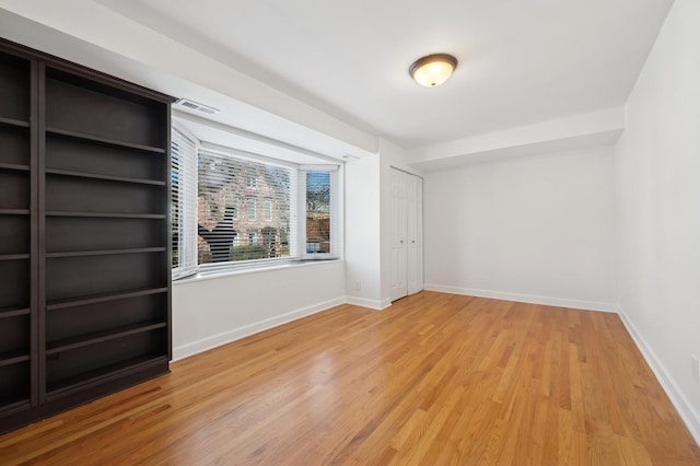 empty room featuring hardwood / wood-style floors