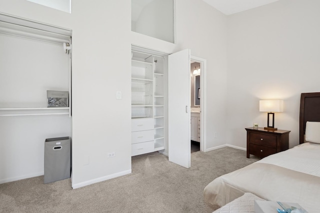 carpeted bedroom with ensuite bath