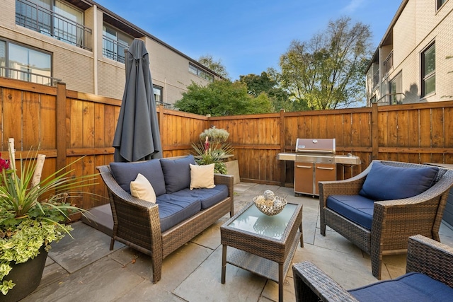 view of patio with area for grilling and outdoor lounge area