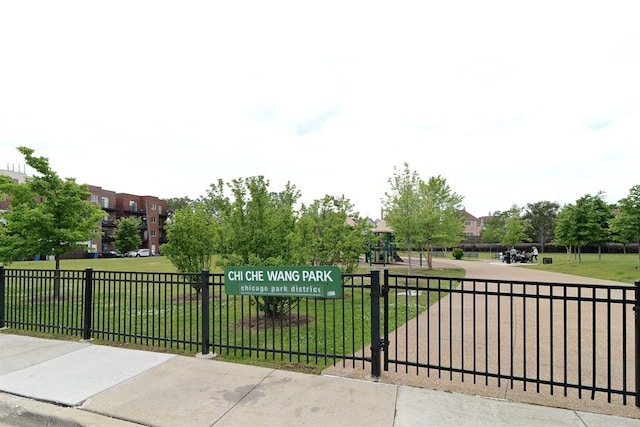 view of gate featuring a lawn