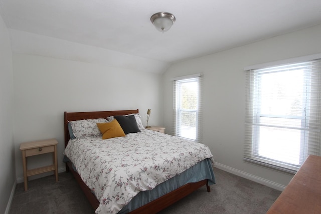 carpeted bedroom featuring lofted ceiling