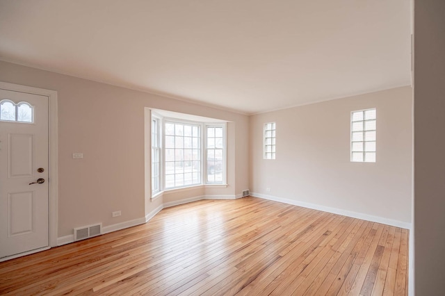 foyer featuring a wealth of natural light and light wood-type flooring