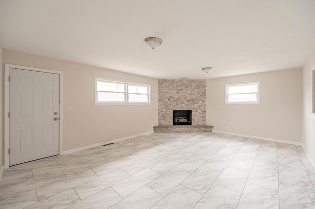 unfurnished living room with a fireplace