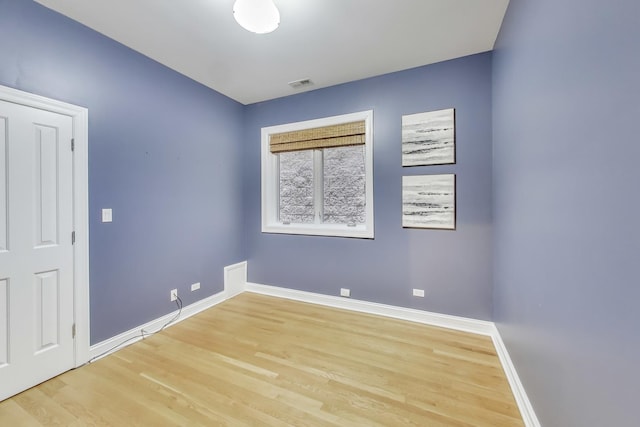 unfurnished room featuring light wood-type flooring