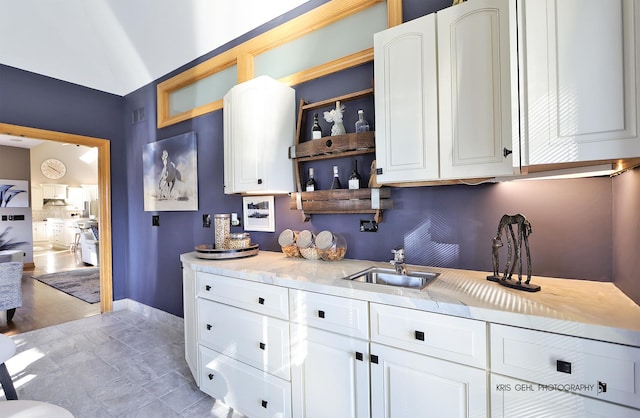 kitchen with sink and white cabinets