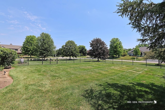 view of yard with a rural view