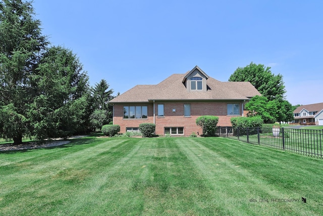 back of property featuring a lawn