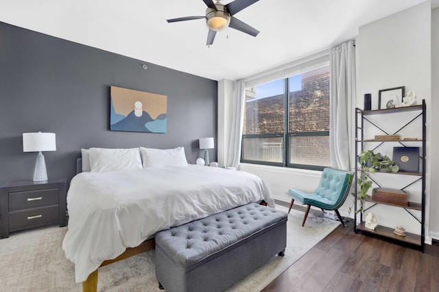 bedroom with ceiling fan and hardwood / wood-style floors