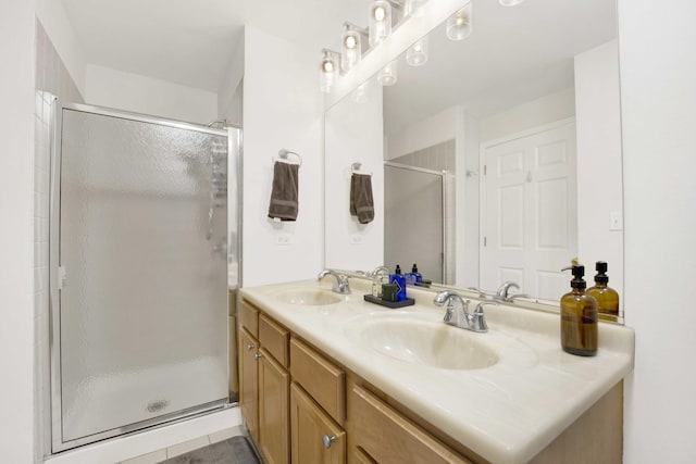 bathroom featuring vanity, tile patterned floors, and walk in shower