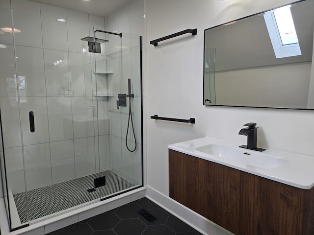 bathroom with vanity, a shower with door, and tile patterned floors