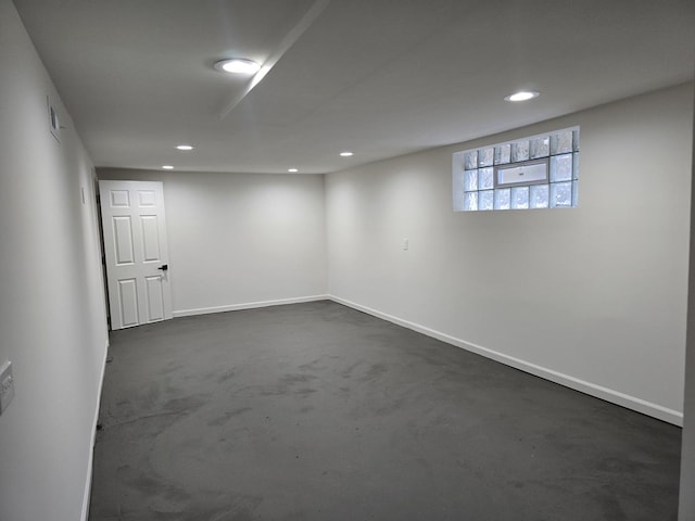 basement with dark colored carpet