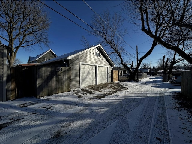 exterior space featuring an outbuilding and a garage