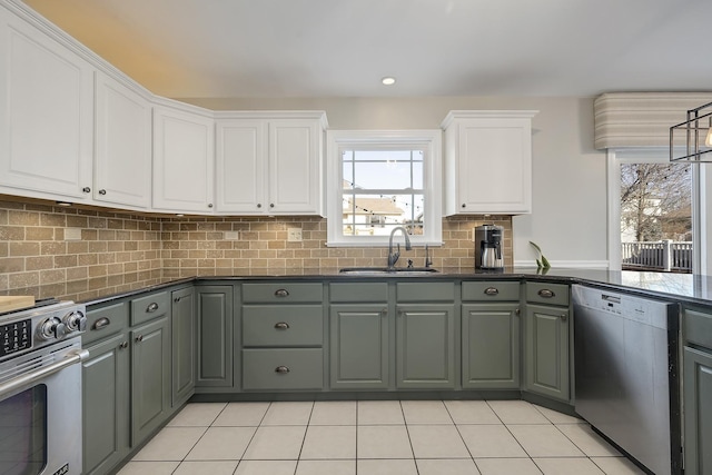 kitchen with sink, light tile patterned floors, gray cabinets, stainless steel appliances, and white cabinets