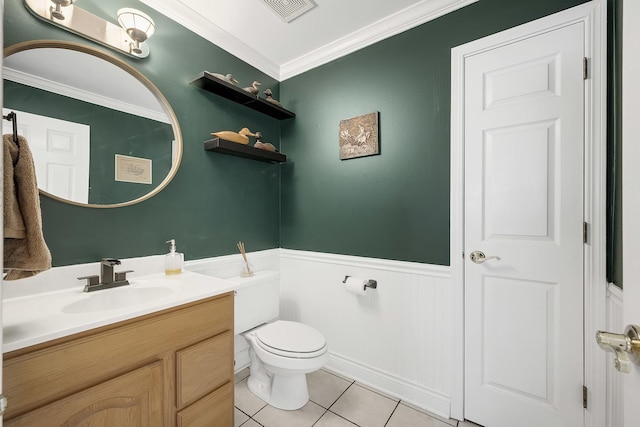 bathroom with vanity, crown molding, tile patterned floors, and toilet