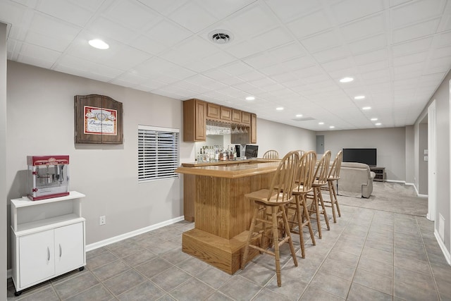 bar featuring tile patterned flooring