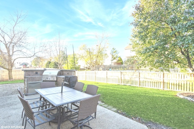 view of patio featuring a grill and a water view