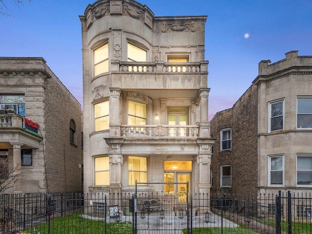 view of front of property with a balcony