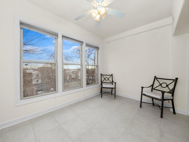 sitting room with ceiling fan