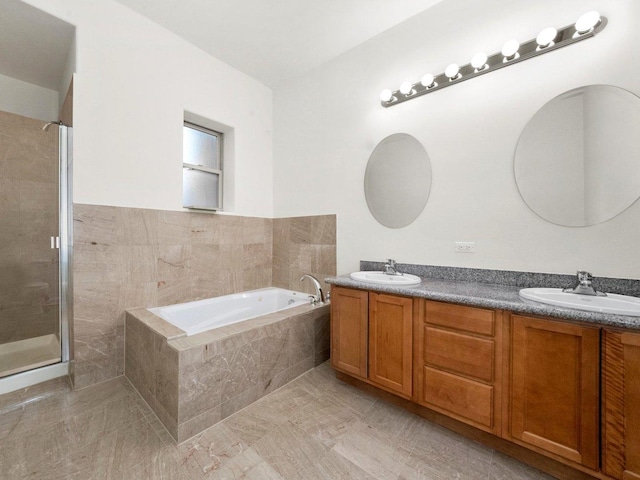 bathroom featuring tile patterned floors, vanity, and separate shower and tub