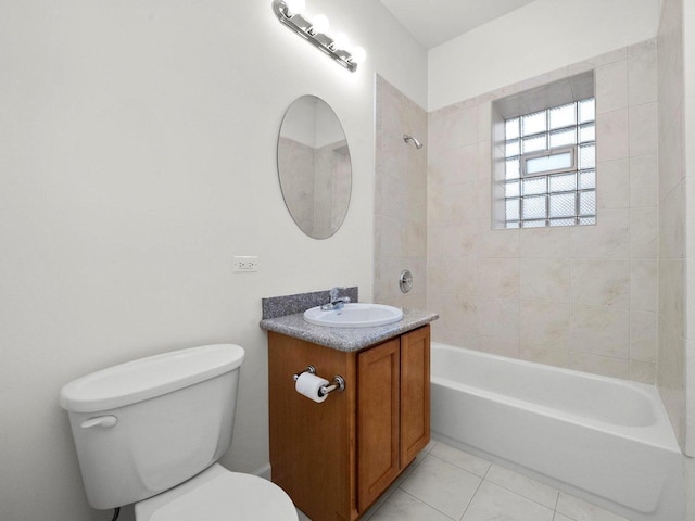 full bathroom with tiled shower / bath combo, toilet, tile patterned flooring, and vanity