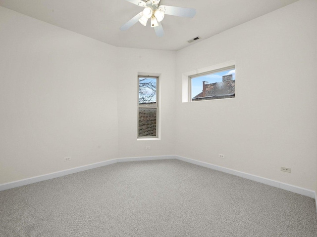 carpeted empty room with ceiling fan