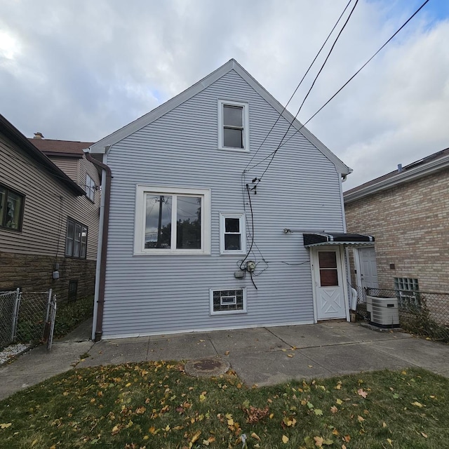 back of house with a patio area and central air condition unit