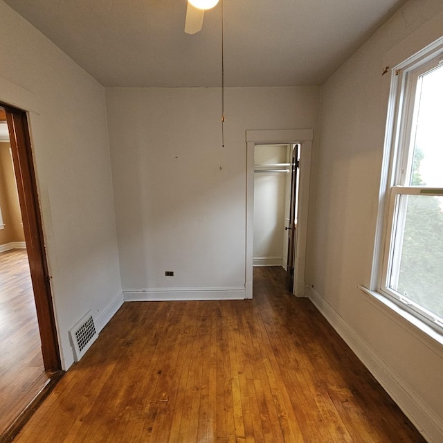 spare room featuring ceiling fan and hardwood / wood-style floors