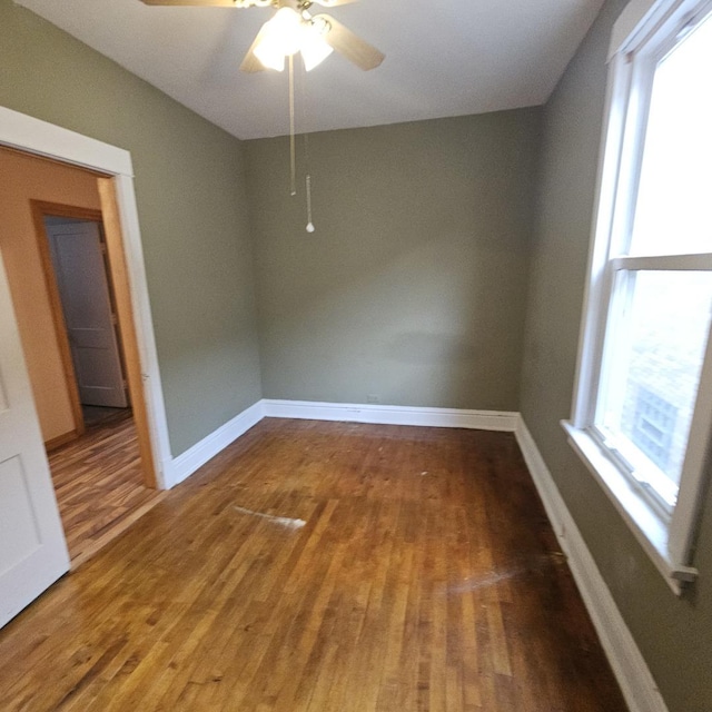 empty room featuring ceiling fan and wood-type flooring