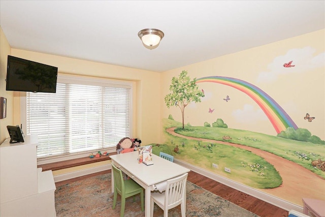 rec room featuring baseboards and wood finished floors