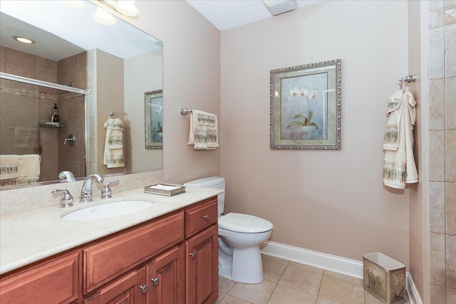 full bathroom featuring tile patterned flooring, vanity, toilet, baseboards, and a stall shower