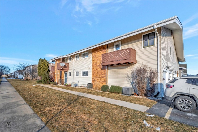 exterior space featuring a garage and central AC unit