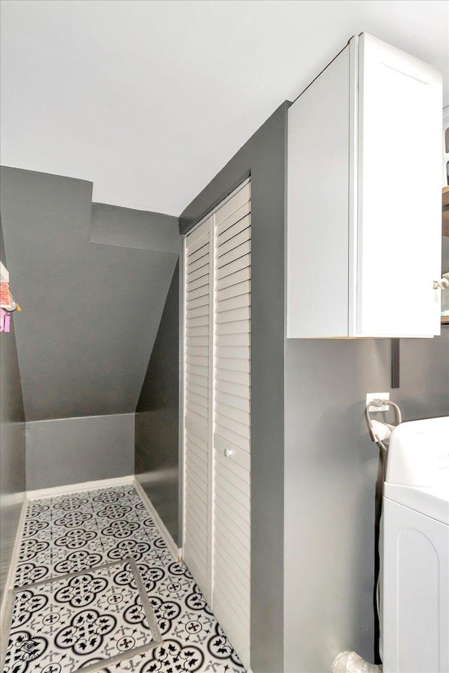 interior space with washer / clothes dryer and cabinets