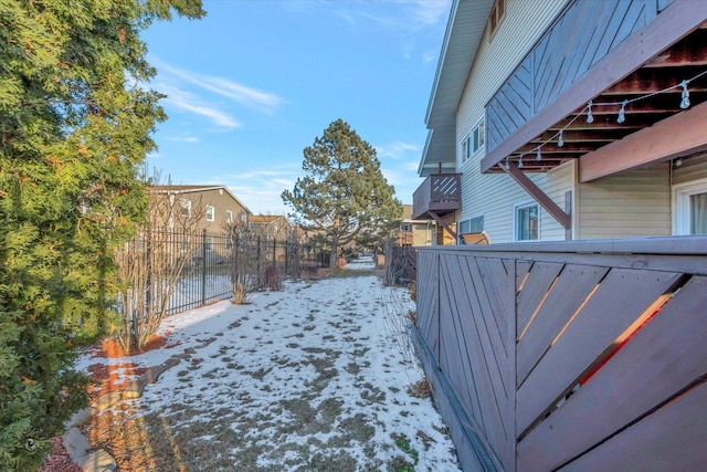 view of yard covered in snow