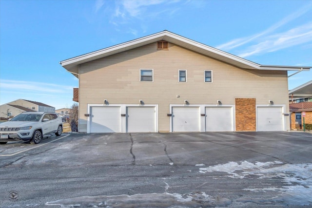 view of side of home with a garage