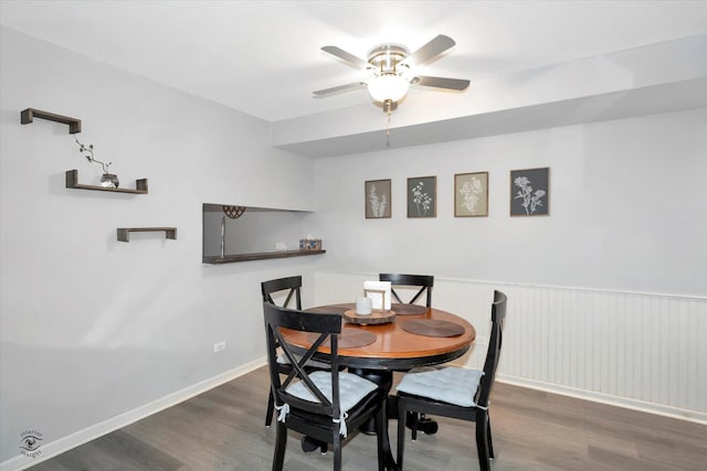 dining space featuring dark wood-type flooring and ceiling fan