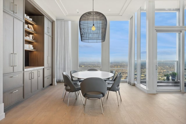 14 W Superior St Unit 6900, Chicago, IL 60654 - dining room with floor to ceiling windows and light wood-type flooring
