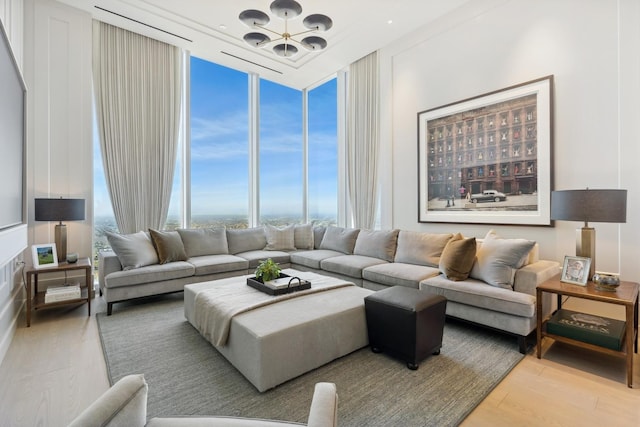 14 W Superior St Unit 6900, Chicago, IL 60654 - living room with an inviting chandelier, floor to ceiling windows, and light hardwood / wood-style floors