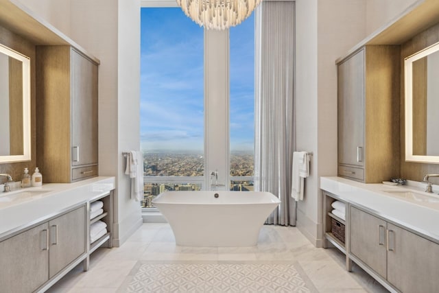 14 W Superior St Unit 6900, Chicago, IL 60654 - bathroom with a tub to relax in, vanity, floor to ceiling windows, and a notable chandelier