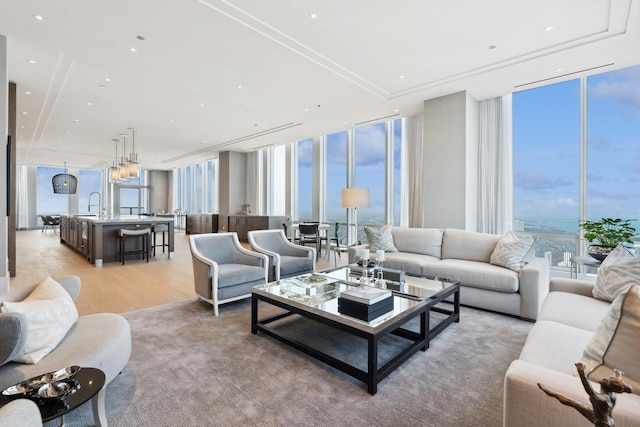 14 W Superior St Unit 6900, Chicago, IL 60654 - living room featuring floor to ceiling windows, a healthy amount of sunlight, and light hardwood / wood-style floors