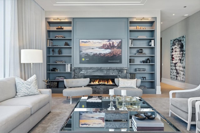 14 W Superior St Unit 6900, Chicago, IL 60654 - living room with a premium fireplace, wood-type flooring, and built in shelves