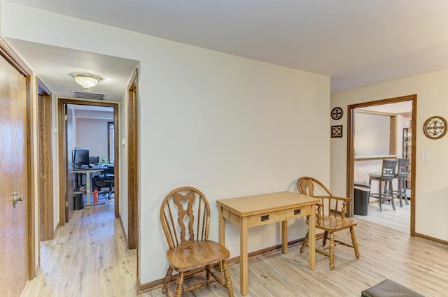 dining space with light wood-type flooring