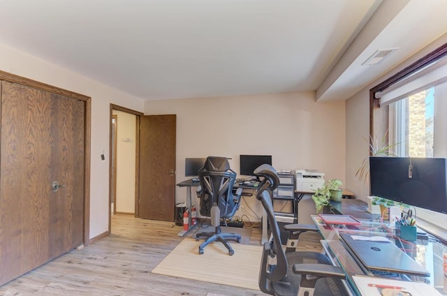 office area with light hardwood / wood-style flooring